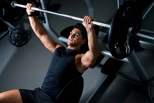 man performing a bench press